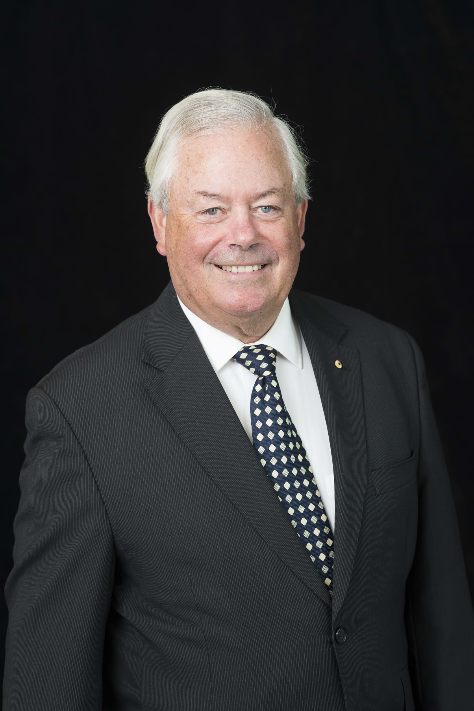 Corporate Portrait Photography | Melbourne Photography | Individual head and shoulders corporate portrait of man on black background