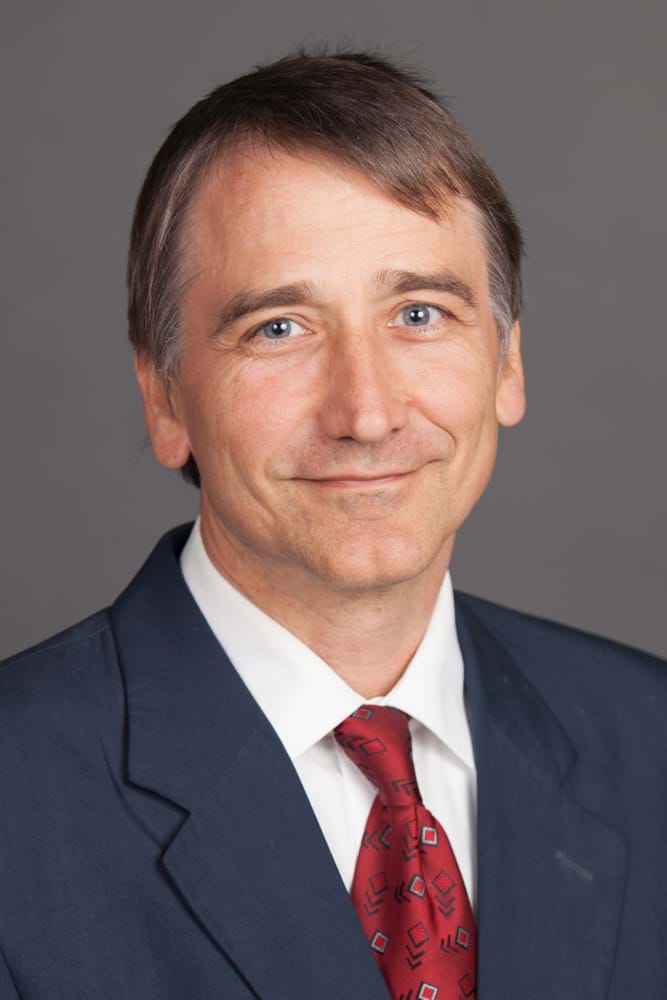 Corporate Portrait Photography | Melbourne Photography | Individual head and shoulders corporate portrait of man on grey background